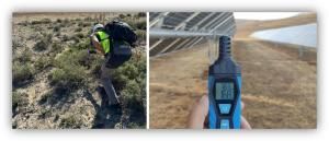 Trabajo de campo en una planta solar, con una persona inspeccionando el terreno y un medidor portátil frente a paneles solares